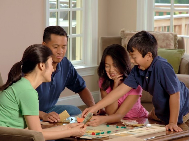 Family playing board game
